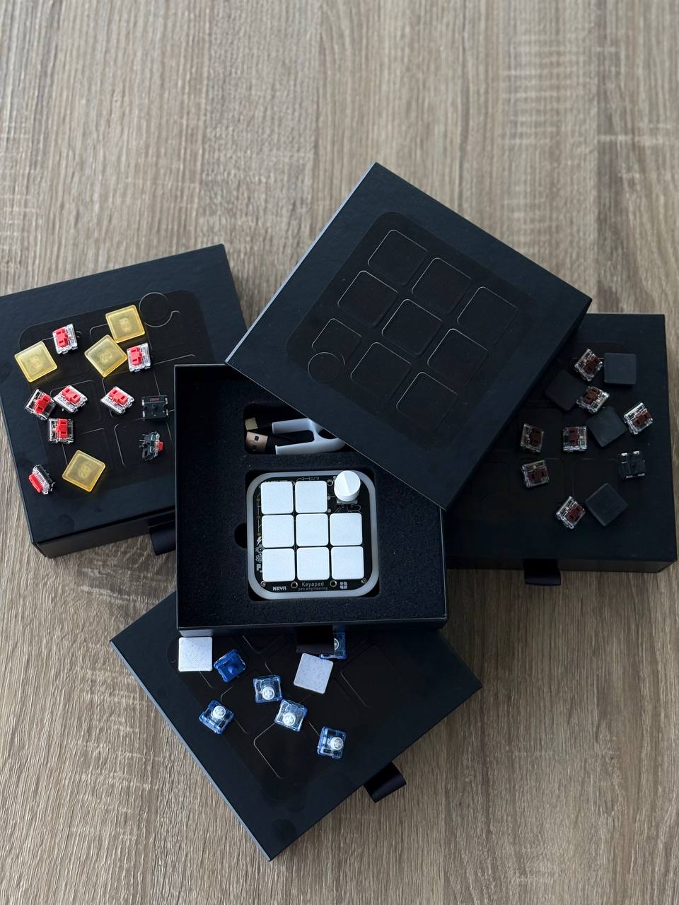 KeyaPad boxes laid out with linear, tactile, clicky and silent mechanical switches for hot-swapping